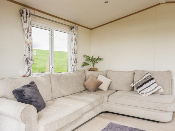 Cae'r Wylan is in Aberdaron, Gwynedd. Two-bedroom lodge enjoying rural and sea views. Stylish. Pets.