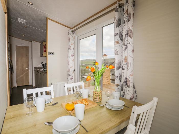 Cae'r Wylan is in Aberdaron, Gwynedd. Two-bedroom lodge enjoying rural and sea views. Stylish. Pets.