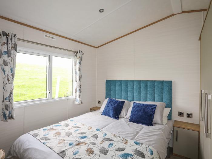 Cae'r Wylan is in Aberdaron, Gwynedd. Two-bedroom lodge enjoying rural and sea views. Stylish. Pets.