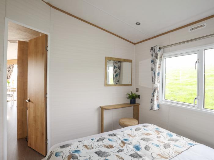 Cae'r Wylan is in Aberdaron, Gwynedd. Two-bedroom lodge enjoying rural and sea views. Stylish. Pets.