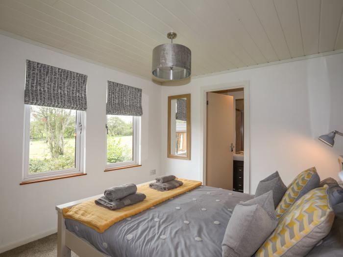 32 Sanctuary Lodge near Y Ffor, Gwynedd. Enclosed decking with furniture. 3 bedrooms. Electric fire.