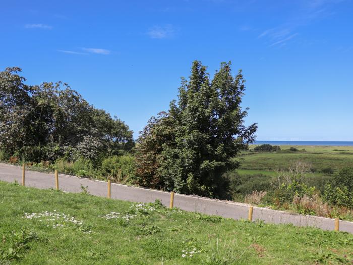 The Stargazer in Gronant, Denbighshire. One-bedroom, stylish home with distant sea views. Near beach