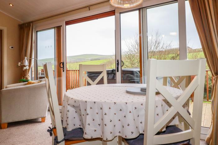 25 Bossiney Bay, near Tintagel, Cornwall. Two-bedroom lodge with rural views and hot tub. Open-plan.