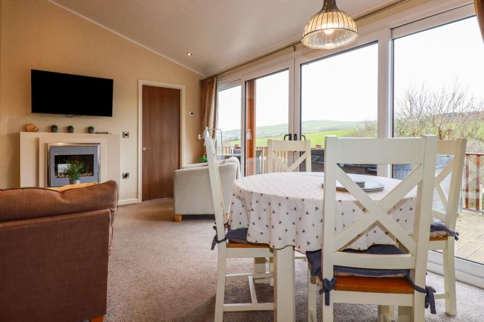 25 Bossiney Bay, near Tintagel, Cornwall. Two-bedroom lodge with rural views and hot tub. Open-plan.