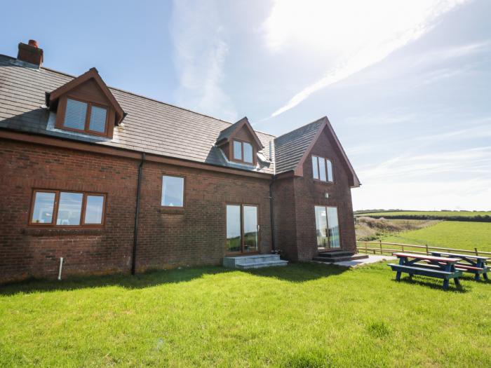 Halls Farm is near Poughill, Cornwall. Close to amenities and beach. Open fire. Smart TV. Sea views.