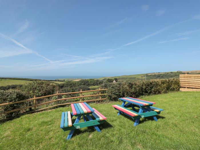 Halls Farm is near Poughill, Cornwall. Close to amenities and beach. Open fire. Smart TV. Sea views.