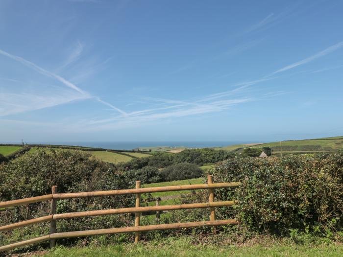 Halls Farm is near Poughill, Cornwall. Close to amenities and beach. Open fire. Smart TV. Sea views.
