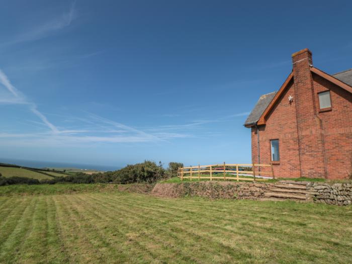 Halls Farm is near Poughill, Cornwall. Close to amenities and beach. Open fire. Smart TV. Sea views.