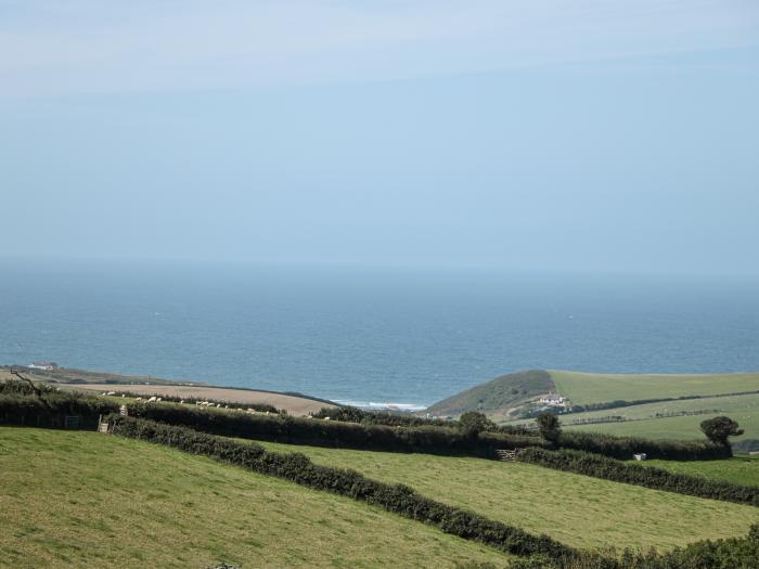 Halls Farm is near Poughill, Cornwall. Close to amenities and beach. Open fire. Smart TV. Sea views.