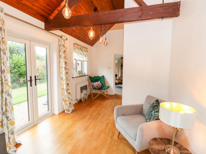 Northern Byre rests in Sopley, Hampshire. Four-bedroom barn conversion, resting near amenities. Pets