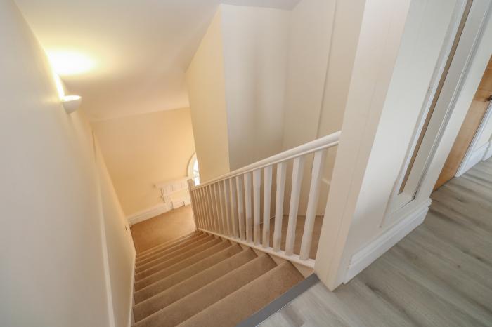 The Penthouse, Helston, Cornwall. Third-floor apartment. Two bedrooms. Open-plan living space. WiFi.