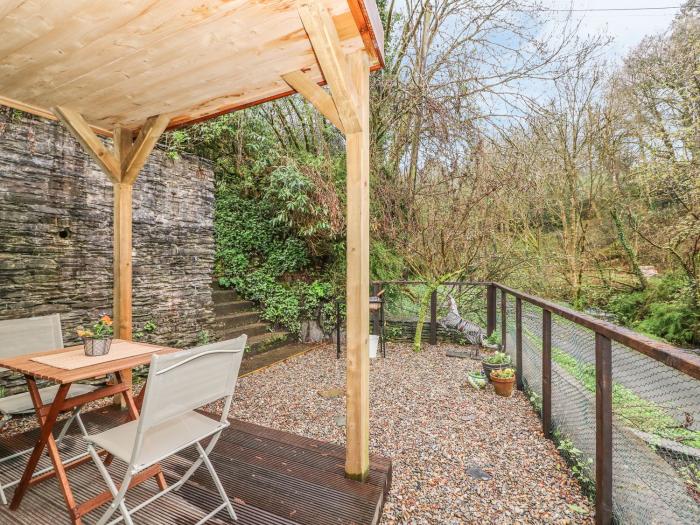 Ty Barddu near Newcastle Emlyn in Carmarthenshire. Elevated, wooden-clad cottage nestled in a valley