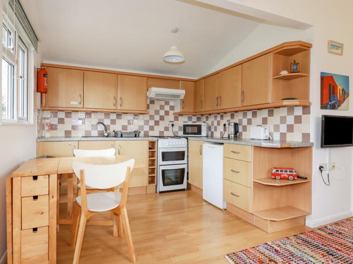 Chalet 208 in St Merryn, Cornwall. Two-bed lodge, with garden and open-plan living. Family-friendly.