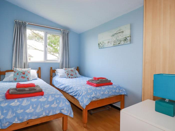 Chalet 208 in St Merryn, Cornwall. Two-bed lodge, with garden and open-plan living. Family-friendly.