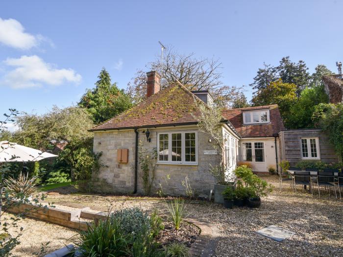 The Carriage House is in Uplyme, Dorset. Dog-friendly. Off-road parking. Smart TV. Woodburning stove