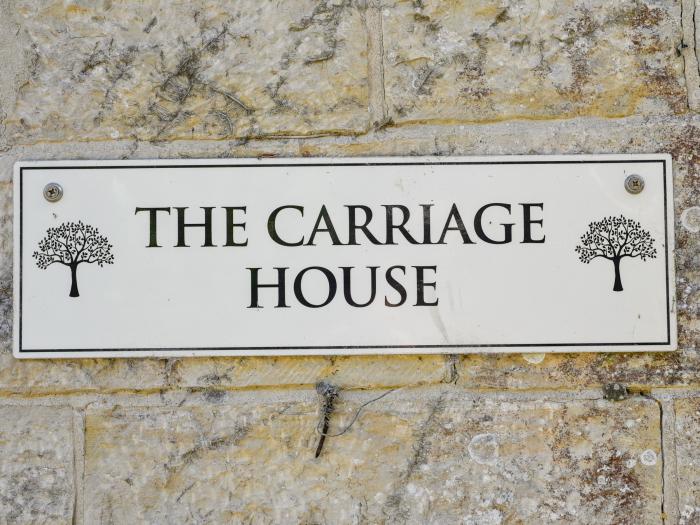 The Carriage House is in Uplyme, Dorset. Dog-friendly. Off-road parking. Smart TV. Woodburning stove