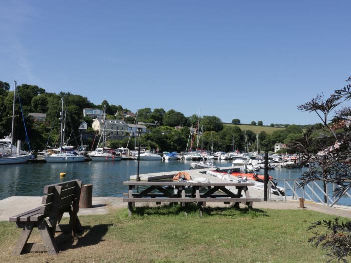 Penmarlam Quay Cottage is in Fowey, Cornwall. Close to amenities and a beach. Off-road parking. Dogs