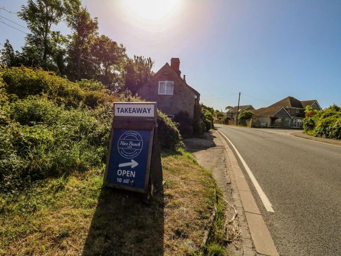 Alice's Cottage, Burton Bradstock, Dorset. Pet-friendly. Near beach. Characterful, thatched cottage.