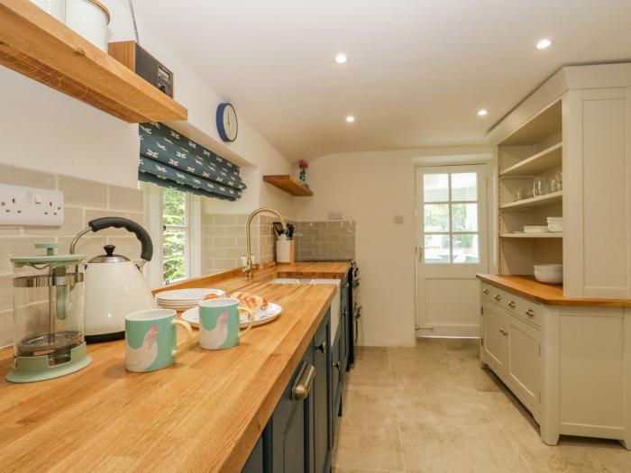 Alice's Cottage, Burton Bradstock, Dorset. Pet-friendly. Near beach. Characterful, thatched cottage.