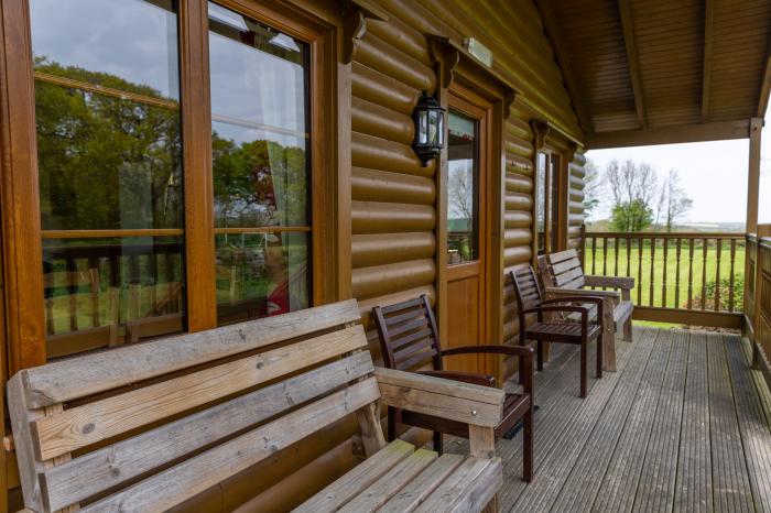 Tarka's Holt Log Cabin, Torrington, Devon. Set on a spacious parkland with on-site facilities. WiFi.