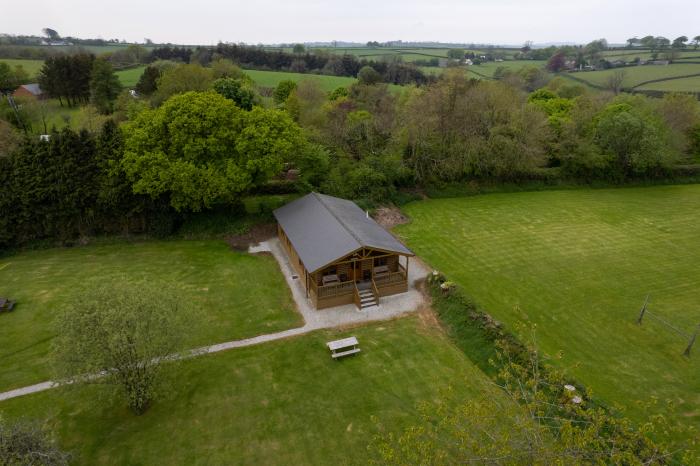 Tarka's Holt Log Cabin, Torrington, Devon. Set on a spacious parkland with on-site facilities. WiFi.