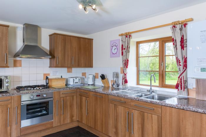 Tarka's Holt Log Cabin, Torrington, Devon. Set on a spacious parkland with on-site facilities. WiFi.