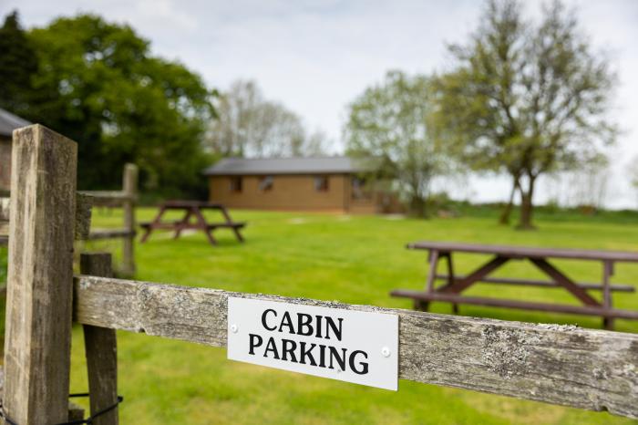 Tarka's Holt Log Cabin, Torrington, Devon. Set on a spacious parkland with on-site facilities. WiFi.