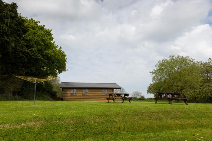 Tarka's Holt Log Cabin, Torrington, Devon. Set on a spacious parkland with on-site facilities. WiFi.