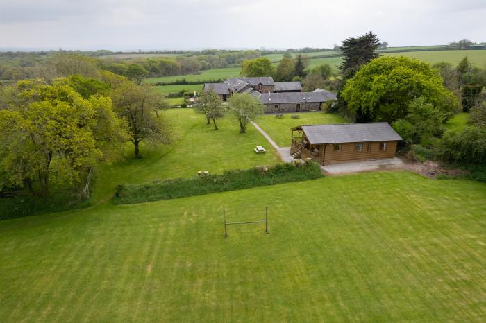 Tarka's Holt Log Cabin, Torrington, Devon. Set on a spacious parkland with on-site facilities. WiFi.