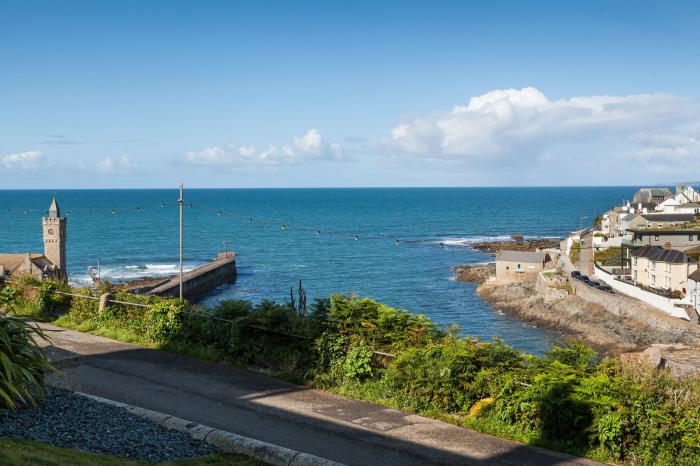 Chy Lowen in Porthleven, Cornwall. Mid-terrace, reverse-level home with sea views. Near beach. Pets.