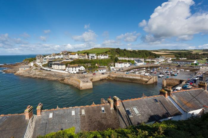 Chy Lowen in Porthleven, Cornwall. Mid-terrace, reverse-level home with sea views. Near beach. Pets.