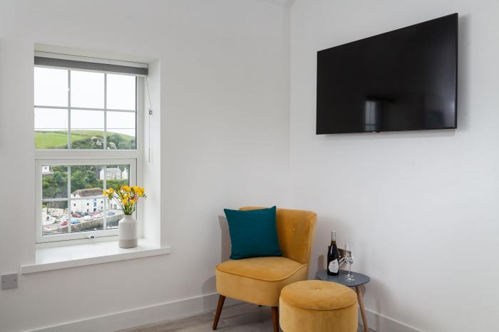 Chy Lowen in Porthleven, Cornwall. Mid-terrace, reverse-level home with sea views. Near beach. Pets.