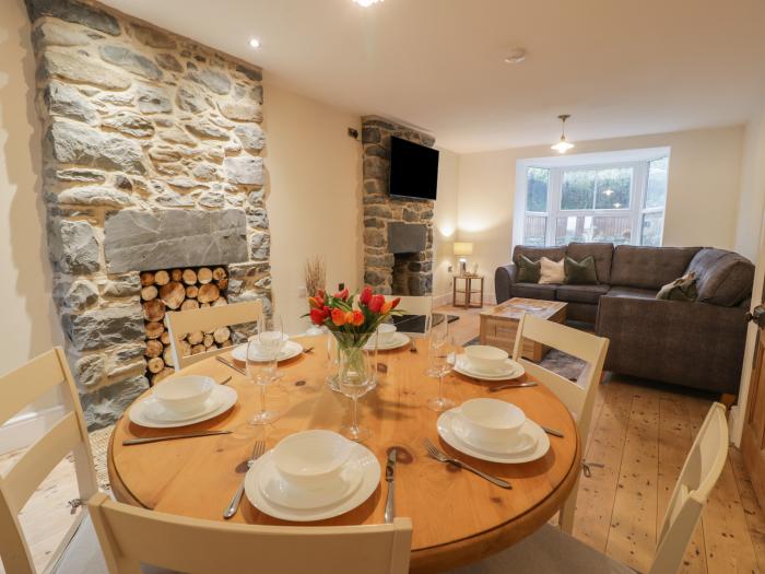 Hendre Cottage in Llwyngwril, Gwynedd. Semi-detached. Pet free. Woodburning stove. Walking location.