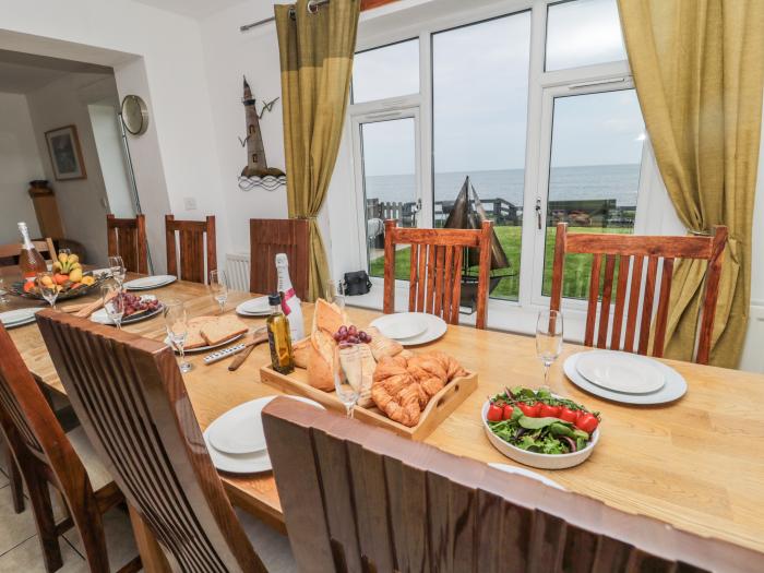 Waters Edge is in Beadnell, Northumberland, 6bed, hot tub, dog-friendly, on the beach, lovely views.