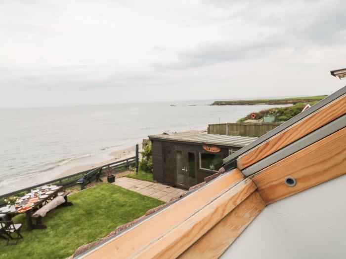 Waters Edge is in Beadnell, Northumberland, 6bed, hot tub, dog-friendly, on the beach, lovely views.