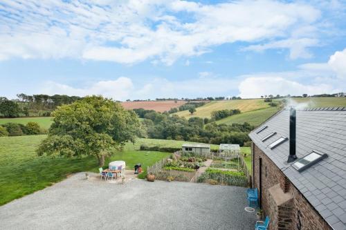NEW Barn Conversion. Idyllic and unspoiled views complete with Hot Tub and Fire